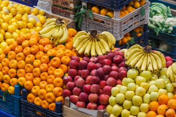 Vegetables and fruits on food stall in a market 