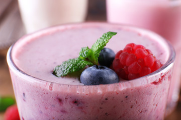 Milkshakes on wooden background, close-up