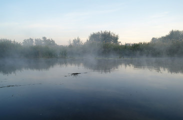 Obraz na płótnie Canvas Morning landscape with fog on the river