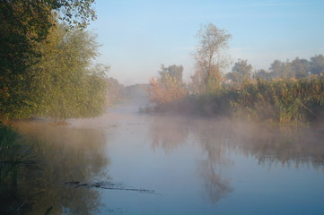 Morning landscape with fog on the river