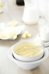 Cooking buttery cream on kitchen
