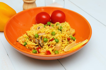 paella with seafood in a ceramic plate