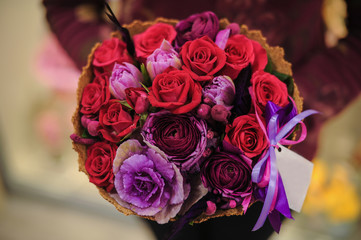 Beautiful bouquet red violet purple flowers, roses,