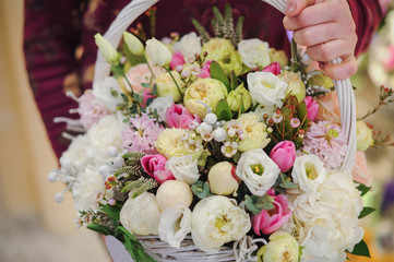 big basket with white light flowers bouquet