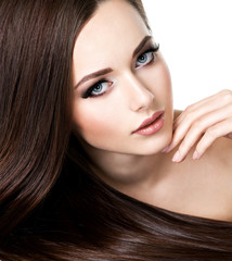 Portrait of beautiful young woman with long straight brown hair