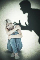Composite image of depressed blonde looking at camera 