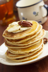 Buttermilk pancakes with banana and pecan
