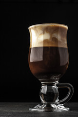 Irish coffee on the dark table