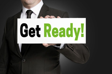 Get ready sign is held by businessman concept
