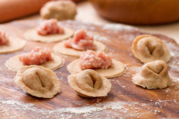 Homemade Italian tortellin from wholegrain flour with meat. Step