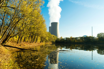 Nuclear power plant next the pond and its reflection