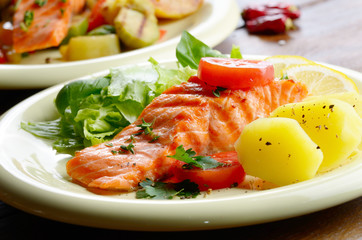 Fried salmon fillet with vegetables