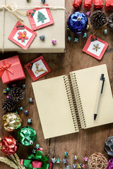 Blank notebook and decoration on old wooden background, Christma