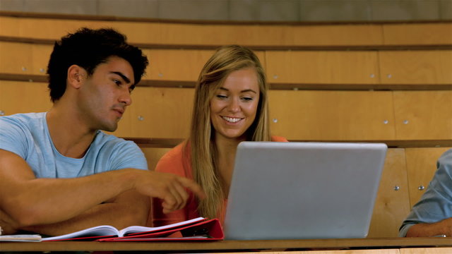 Classmates studying in library