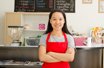 Portrait of woman barista (owner business) in the coffee shop