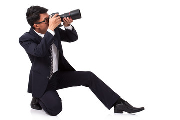 Businessman taking a photo on white background