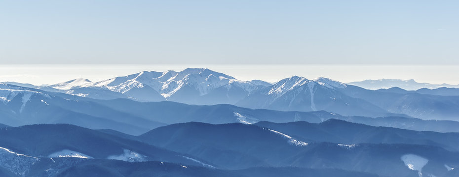 Fototapeta Distant sharp peaks. blue mountain ranges. Ukrainian Carpathian Mountains