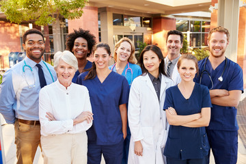 Portrait Of Medical Team Standing Outside Hospital - Powered by Adobe