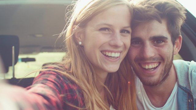 Handheld shot of couple taking a selfie
