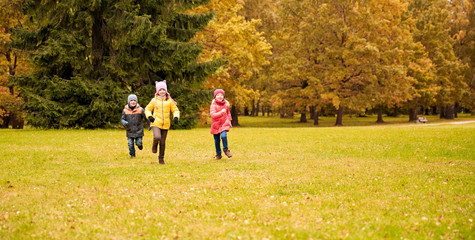 Fototapeta premium group of happy little kids running outdoors