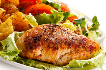 Fried chicken fillet, chips and vegetable salad 