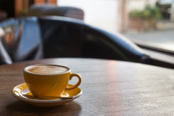 Hot art Latte Coffee in a cup on wooden table.