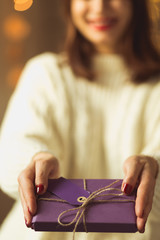 Woman giving christmas gift