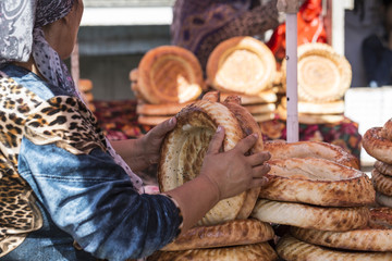 Kirghiz bread tokoch on Sunday market in Osh. Kyrgyzstan.