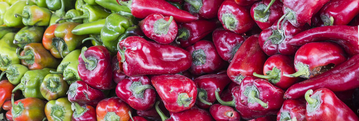 Closeup of green and red hot chili peppers, paprika