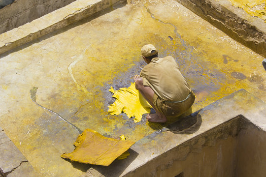 Older man works the leather
An older man is working in the famous tannery complex of Fes in foul smelling conditions. 