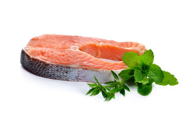 fresh salmon fillet with vegetables  on white background.