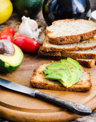 toast with fresh avocado and pepper, healthy snack, vegetarian f