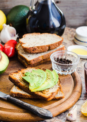 toast with fresh avocado and pepper, healthy snack, vegetarian f