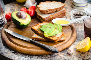 toast with fresh avocado and pepper, healthy snack, vegetarian f