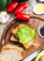 toast with fresh avocado and pepper, healthy snack, top view