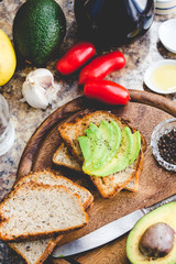 toast with fresh avocado and pepper, healthy snack, top view