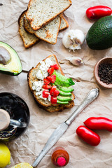 toast with fresh avocado, tomato and goat cheese, vegetarian sna