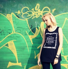 Girl posing near the wall with graffiti