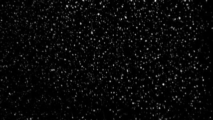 Raindrops of white water falling down on glass. Perfect for digital composing. Pure black background.
