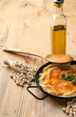 Homemade hummus with garlic and onions paprika