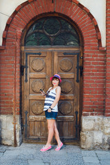 Fototapeta na wymiar happy girl smiling on background of doors