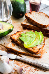 toast with fresh avocado and pepper, healthy snack, vegetarian f