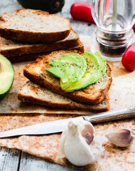toast with fresh avocado and pepper, healthy snack