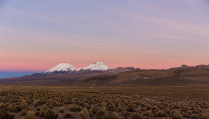 Sunset in Andes. Parinacota and Pomerade volcanos.