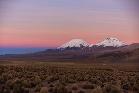 Sunset in Andes. Parinacota and Pomerade volcanos.