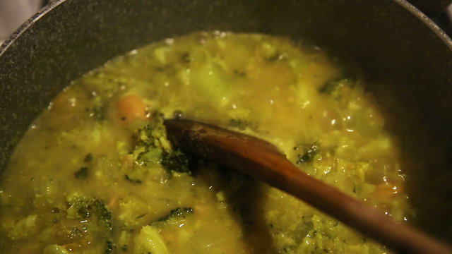 making of broccoli soup, beans and onions, on the stove