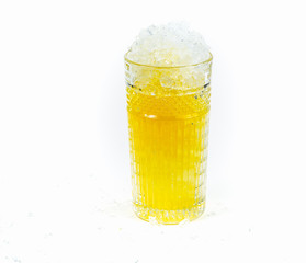 Glass with ice and orange juice cocktail. Cold drinks. White background