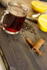 cup with spices on wooden table
