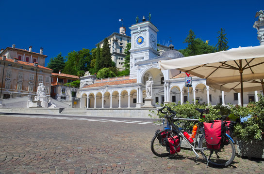 Bike parked in Piazza Libertà, Udine, Italy: riding along the Alpe Adria cycle route (Ciclovia Alpe Adria Radweg)
