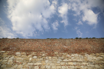 Old big wall against blue sky with copy space